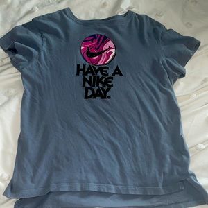 This is a light purple nike shirt.